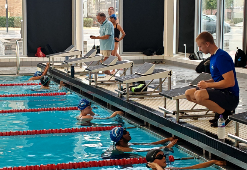Adrian and John coaching swimmers