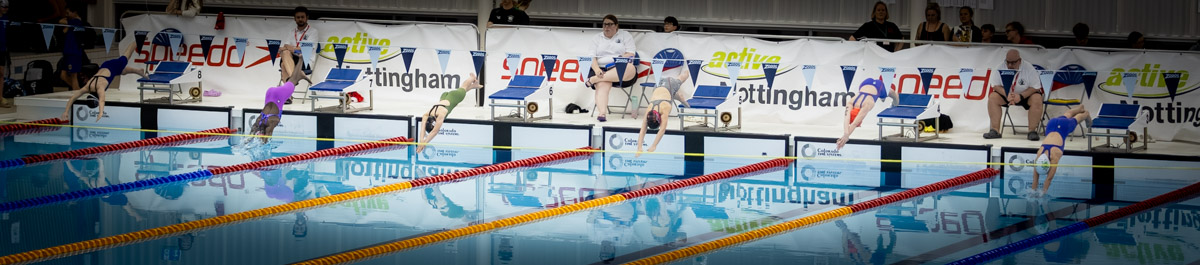 Newark SC swimmers diving at a competition